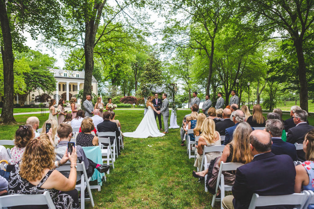 Wedding ceremony on front lawn of the mansion under the Willow Oak Canopy