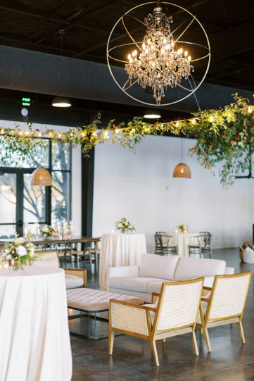 lounge alternative seating wedding reception with hanging greenery