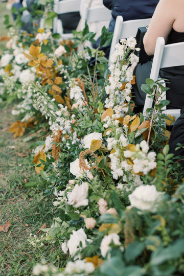 ceremony aisle lined with greenery