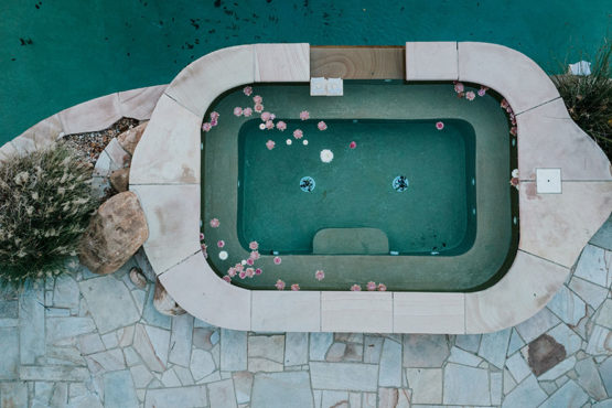 aerial shot of flowers floating in the hot tub