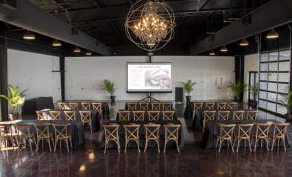 Corporate event setup inside Lakeview Event Center with presentation screen and seating
