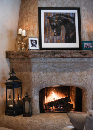 Fireplace with decor inside the primary suite