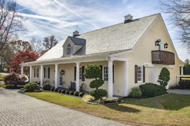 Exterior of Carriage House Stables at lakeside wedding venue with multiple event spaces