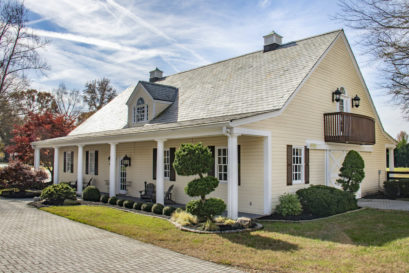 Exterior of Carriage House Stables at lakeside wedding venue with multiple event spaces