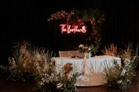 Modern Boho Wedding Reception Sweetheart Table with custom LED neon sign