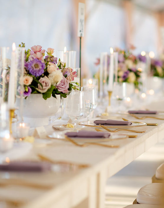 Long Wooden King's Table Decor With Gold Details and Purple Floral Centerpieces
