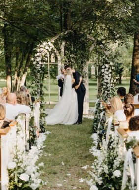 Garden Wedding Ceremony with petal-lined aisle and vintage windows as ceremony backdrop
