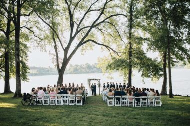Wedding ceremony on Lakeside Lawn with white seating