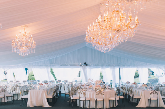 Wedding reception setup on Sunset Terrace with elegant chandeliers