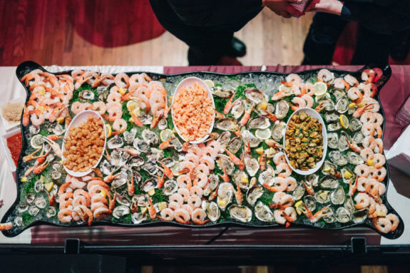Wedding food station raw bar with oysters and shrimp
